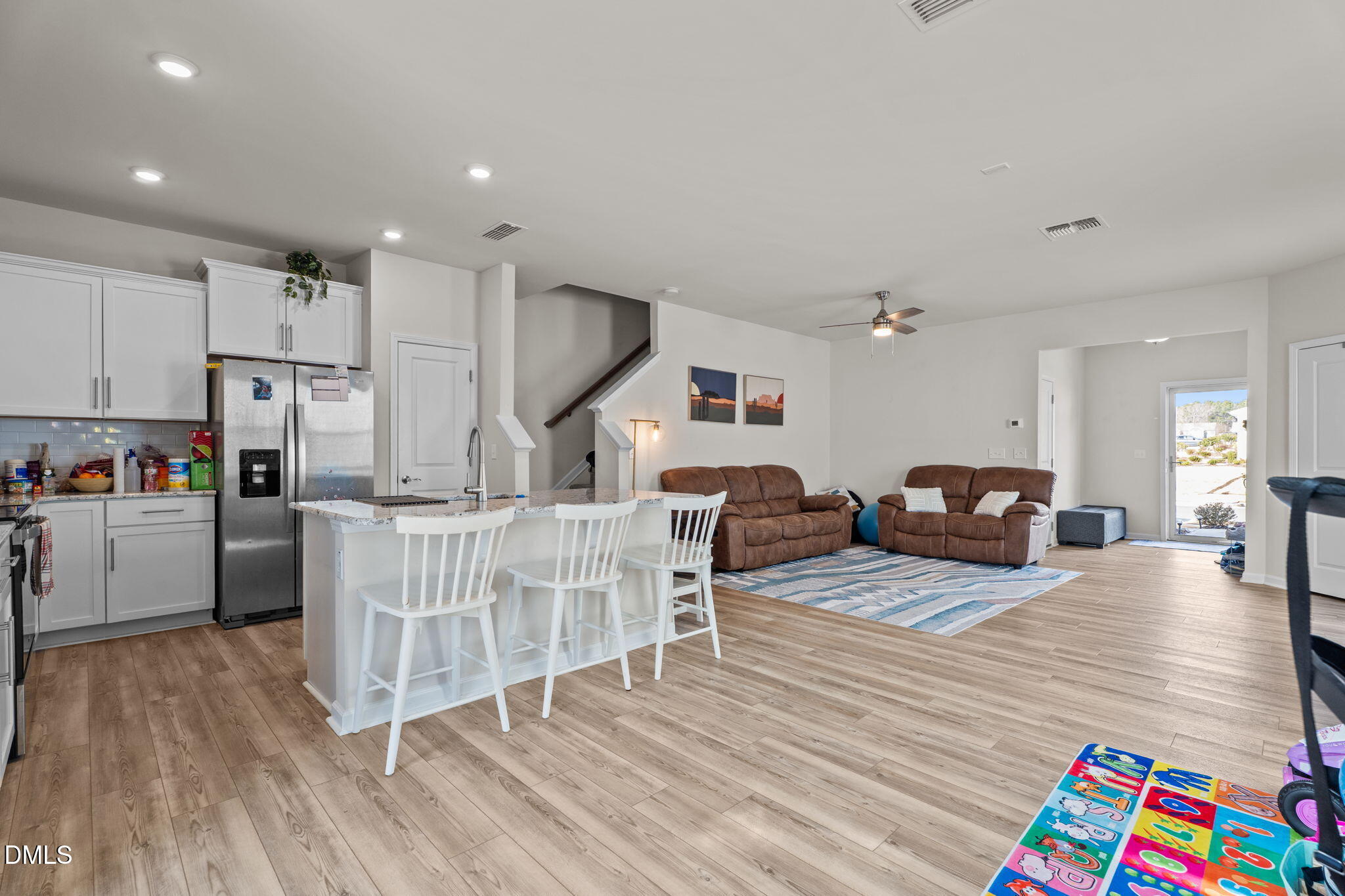 1572 Rhodes Pond Street Wendell, NC 27591 - Photo 13 of 42 a living room with furniture and a wooden floor