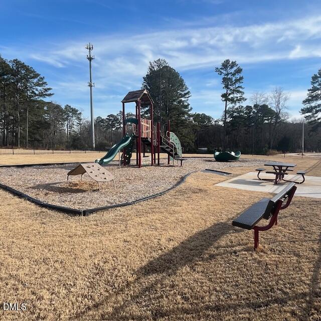 1572 Rhodes Pond Street Wendell, NC 27591 - Photo 23 of 42 a view of a park with swings and slides