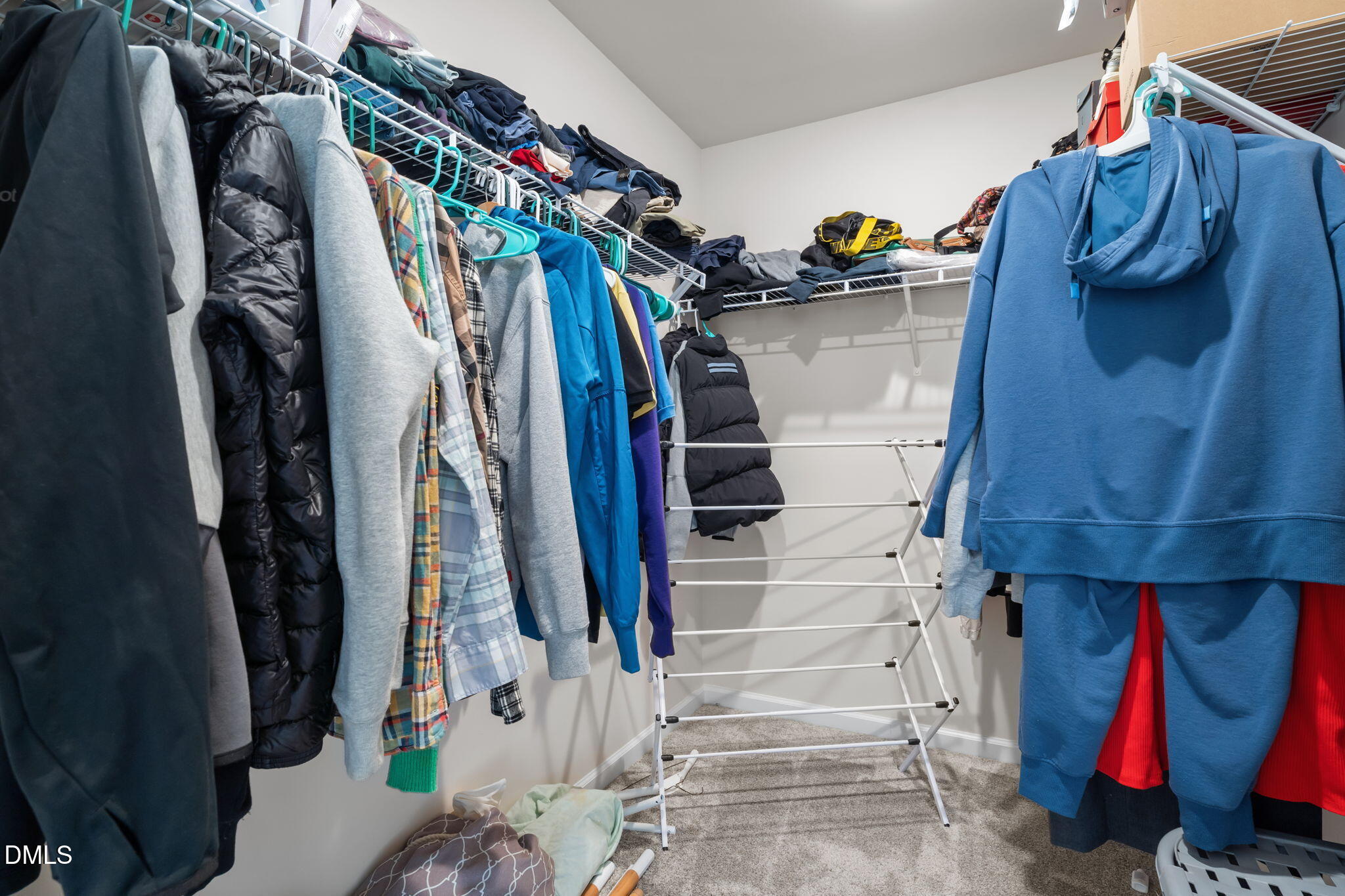 1572 Rhodes Pond Street Wendell, NC 27591 - Photo 27 of 42 a view of walk in closet with clothes and shoes