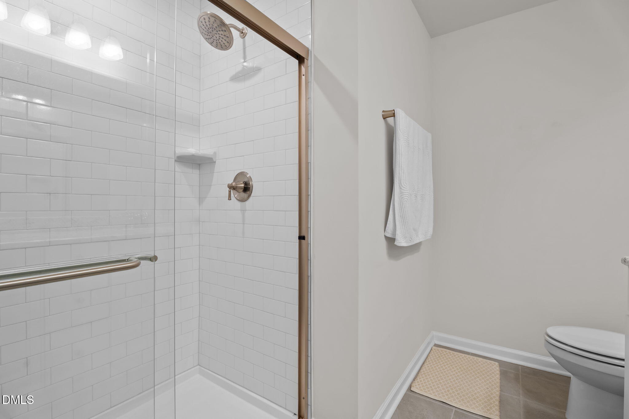 1572 Rhodes Pond Street Wendell, NC 27591 - Photo 29 of 42 a bathroom with a shower and toilet