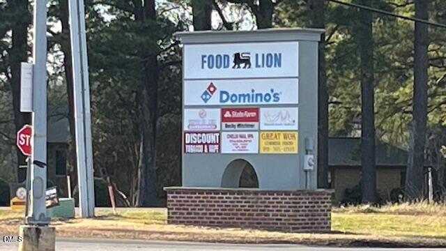 1572 Rhodes Pond Street Wendell, NC 27591 - Photo 38 of 42 a view of a street sign on a road