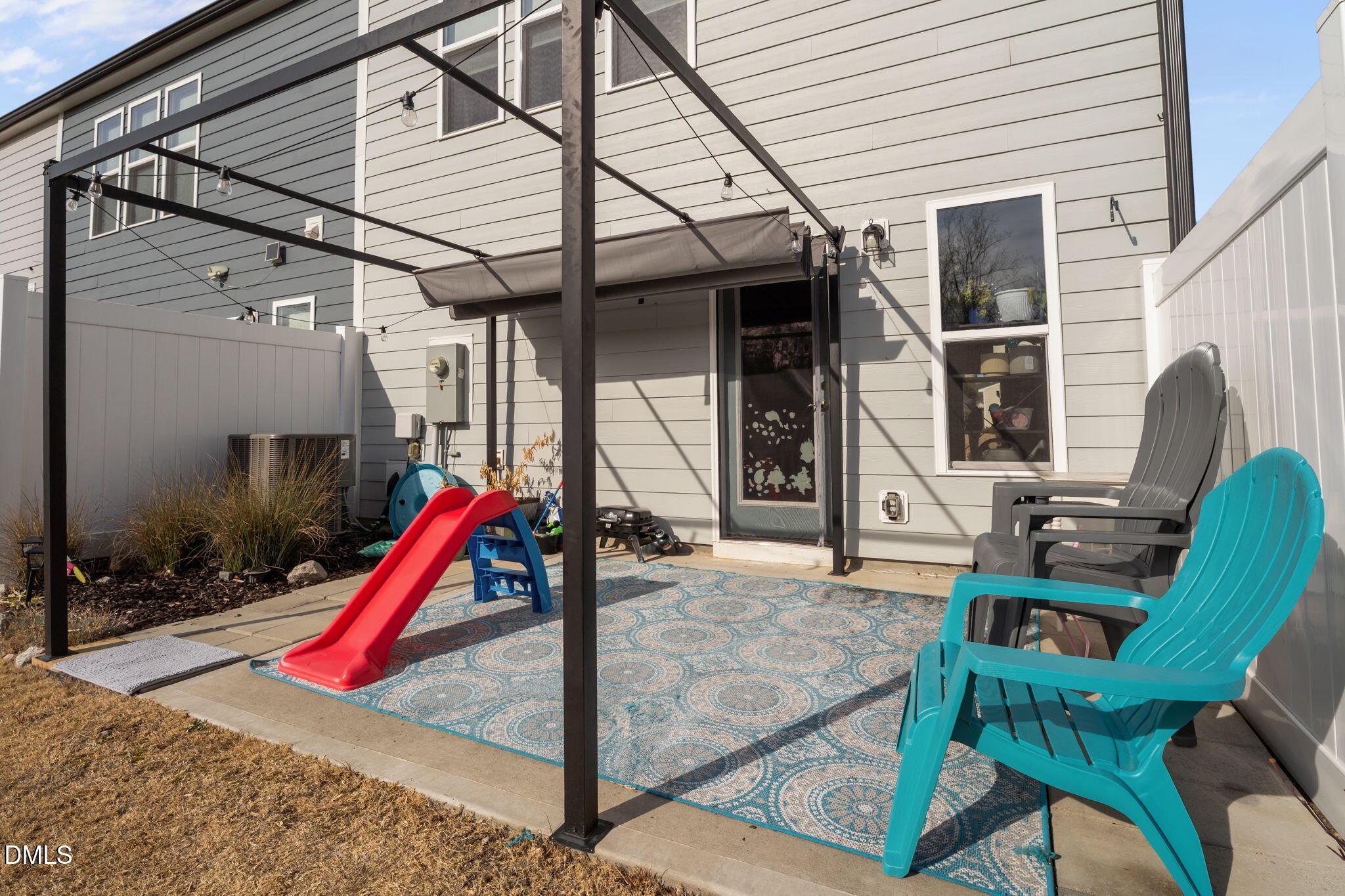 1572 Rhodes Pond Street Wendell, NC 27591 - Photo 4 of 42 a view of a porch with a table and chairs