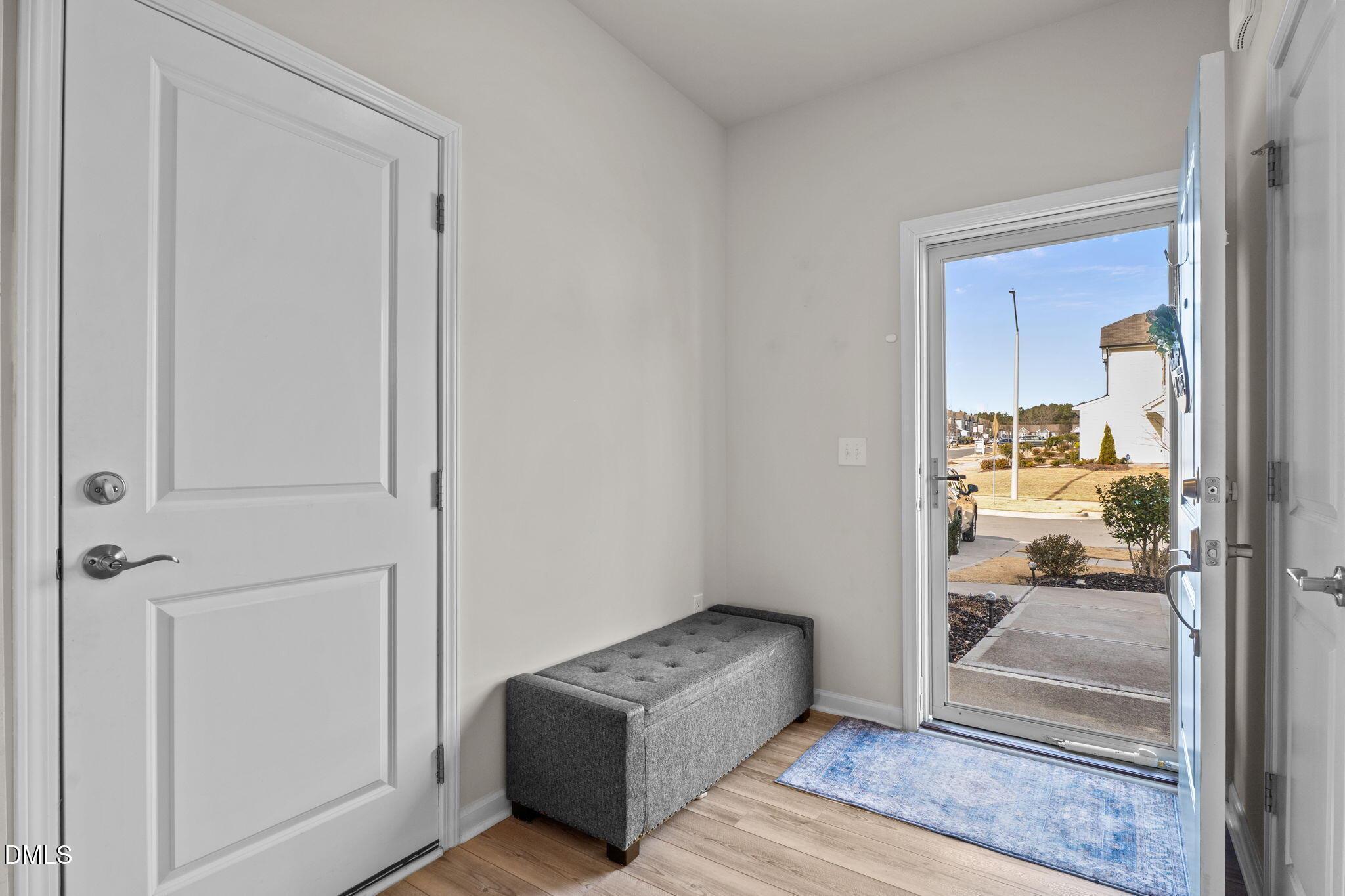 1572 Rhodes Pond Street Wendell, NC 27591 - Photo 5 of 42 a living room with furniture and a glass door shower