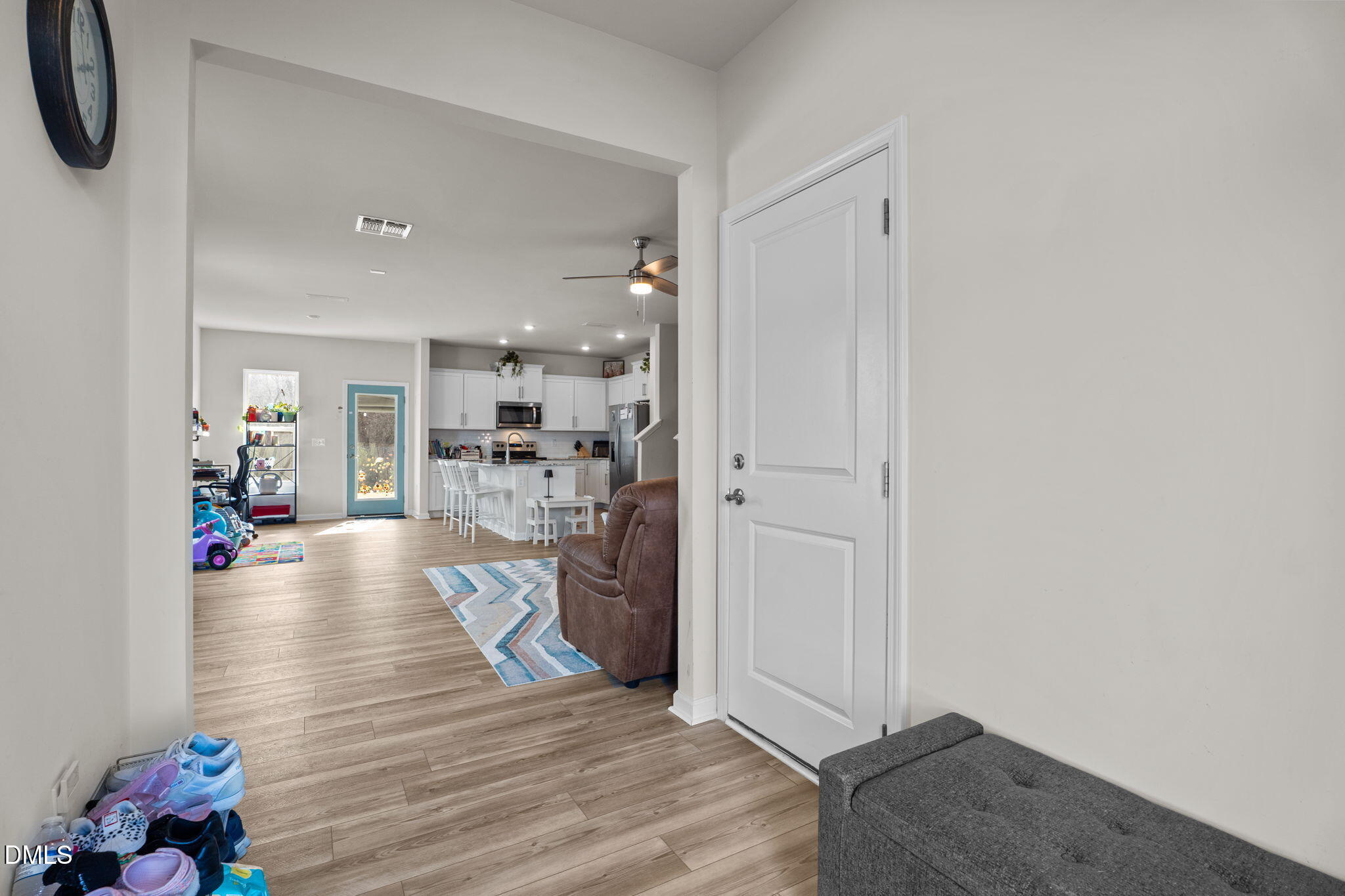 1572 Rhodes Pond Street Wendell, NC 27591 - Photo 6 of 42 a living room with furniture and a wooden floor