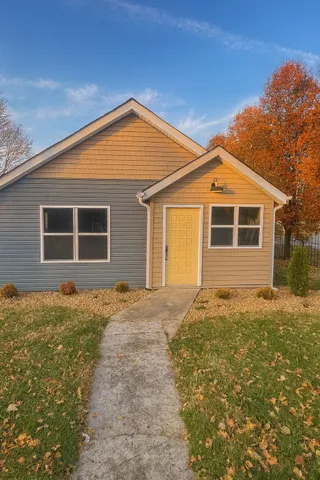 front view of a house with a yard