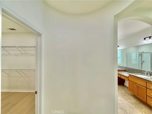 a view of a bathroom from a hallway