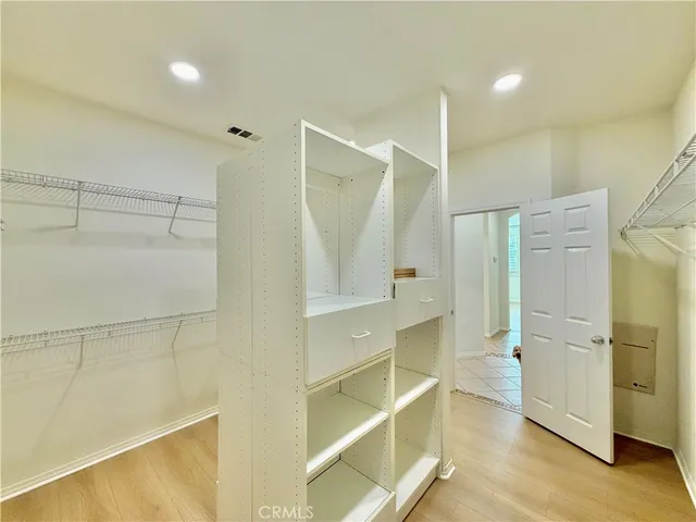 a bathroom with a glass shower door and a sink