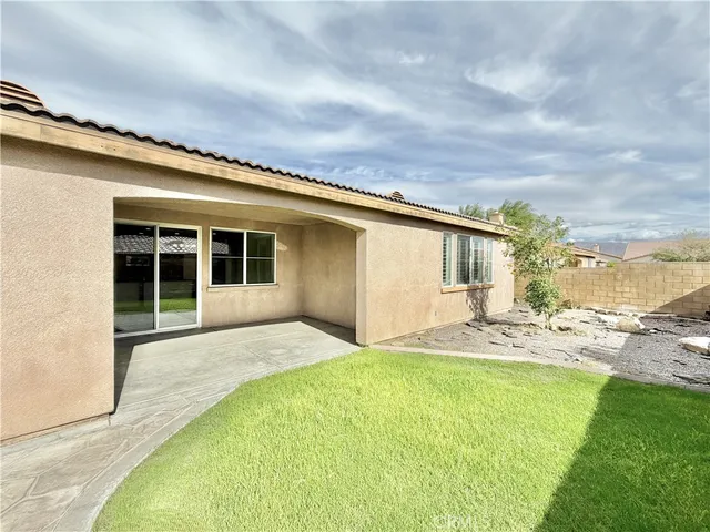 a balcony with table and chairs