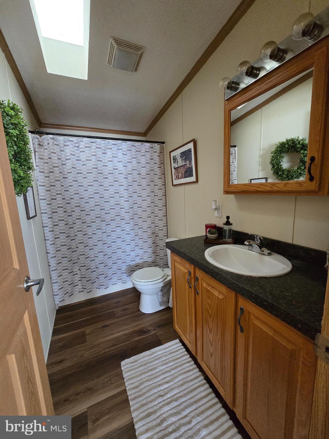 118 Lisa Circle York, PA 17406 - Photo 12 of 12 a bathroom with a granite countertop toilet sink and mirror