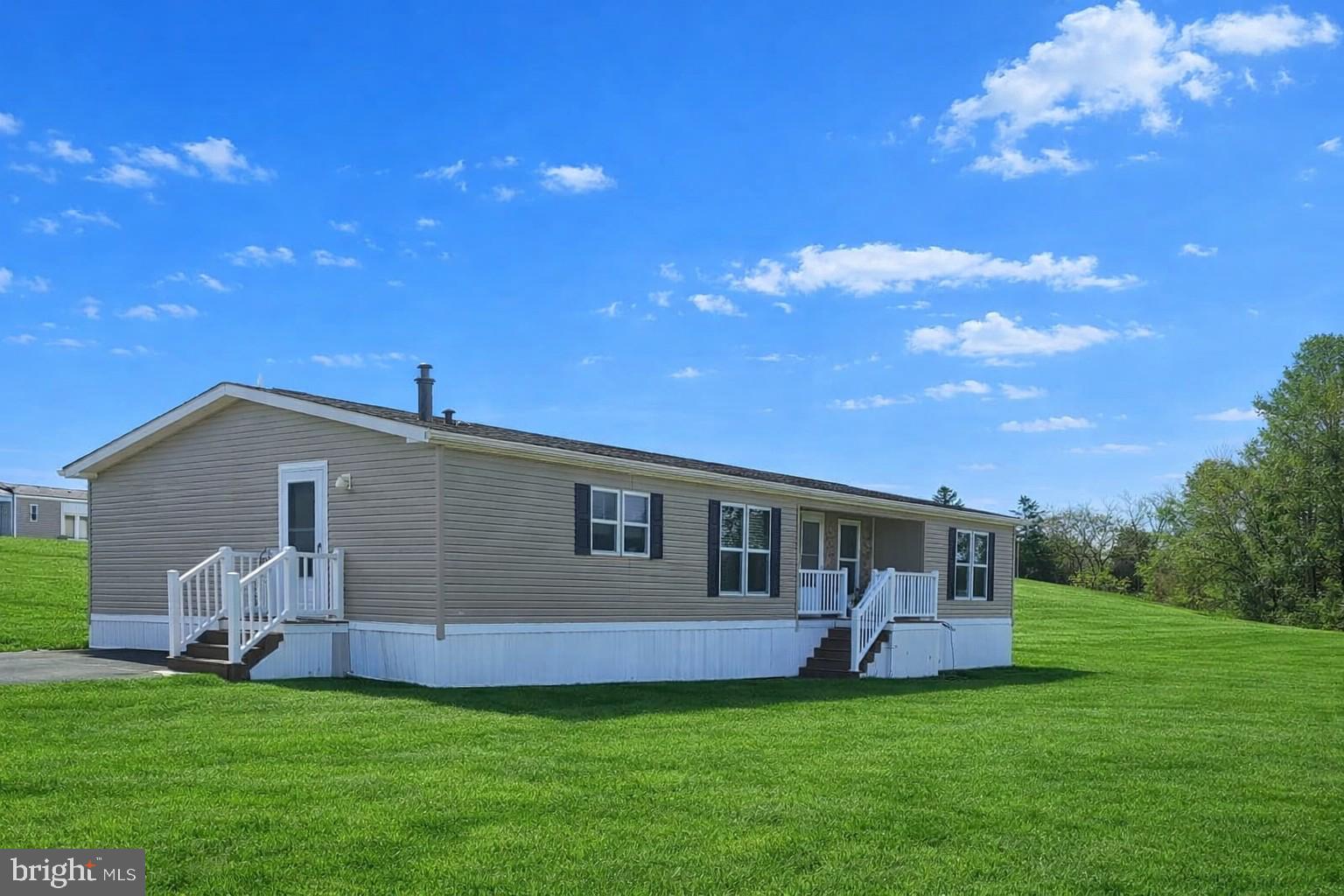 118 Lisa Circle York, PA 17406 - Photo 2 of 12 a front view of a house with a garden