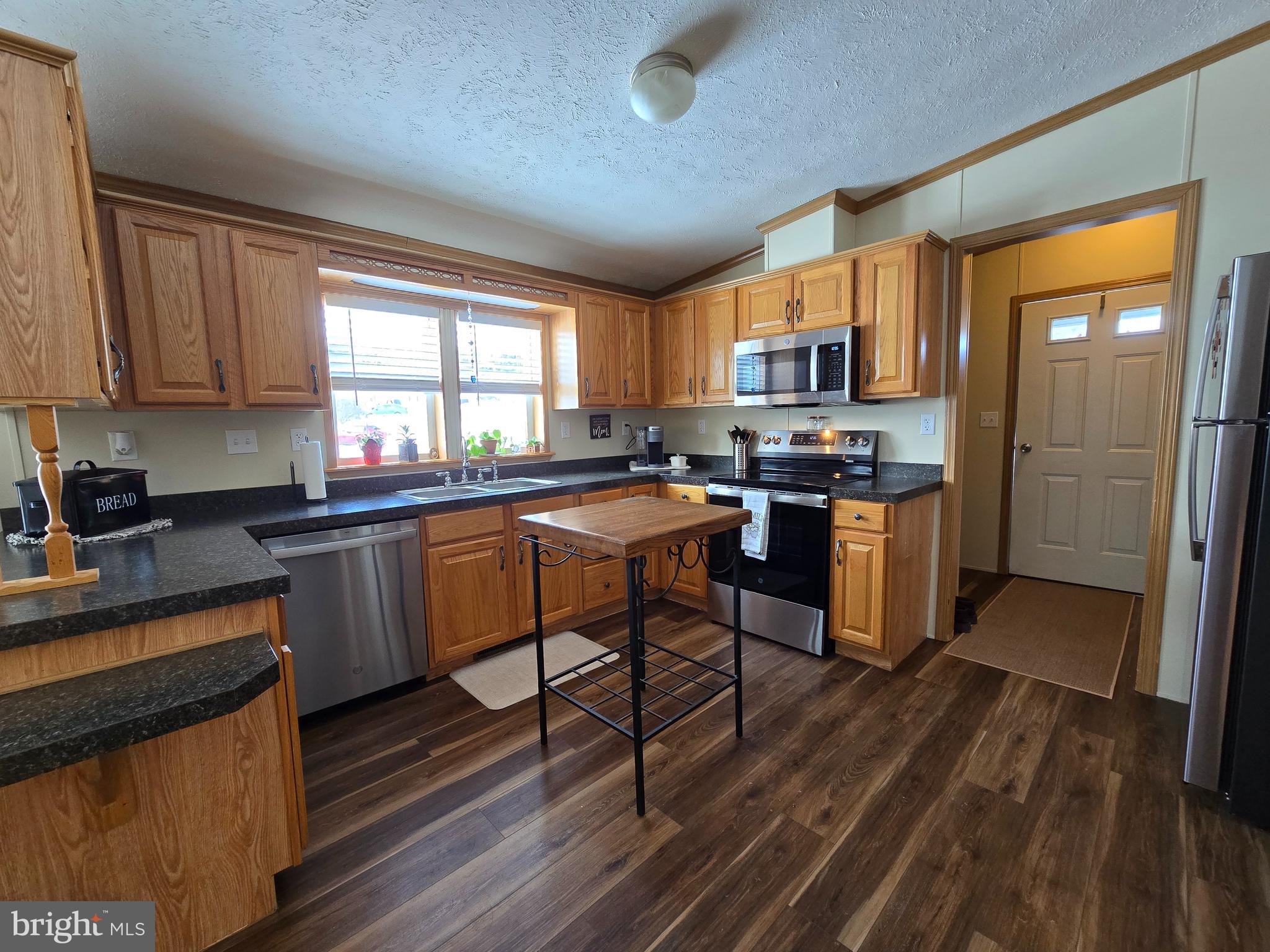 118 Lisa Circle York, PA 17406 - Photo 3 of 12 a kitchen with stainless steel appliances granite countertop sink stove top oven and cabinets