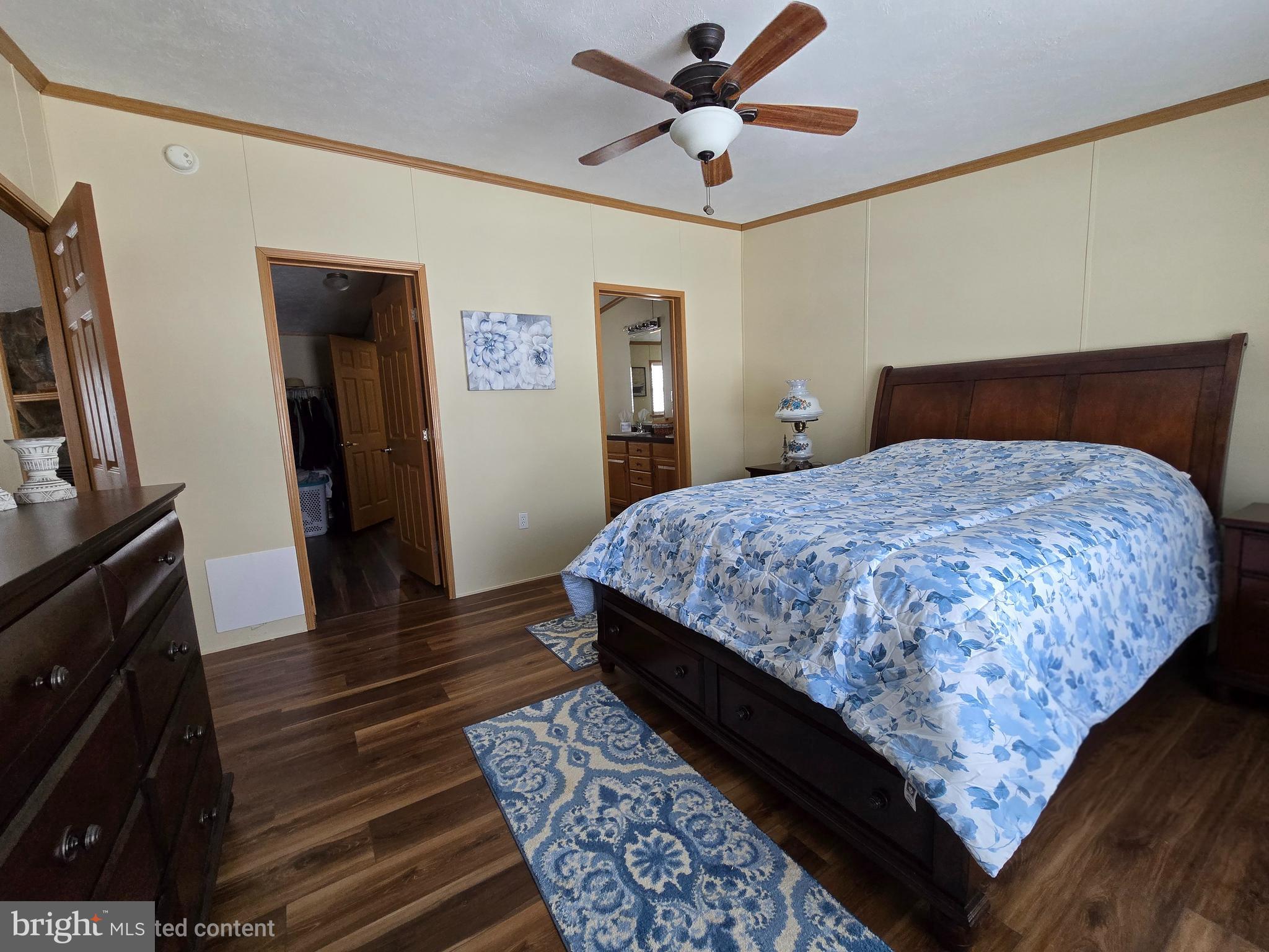 118 Lisa Circle York, PA 17406 - Photo 7 of 12 a bedroom with bed and wooden floor