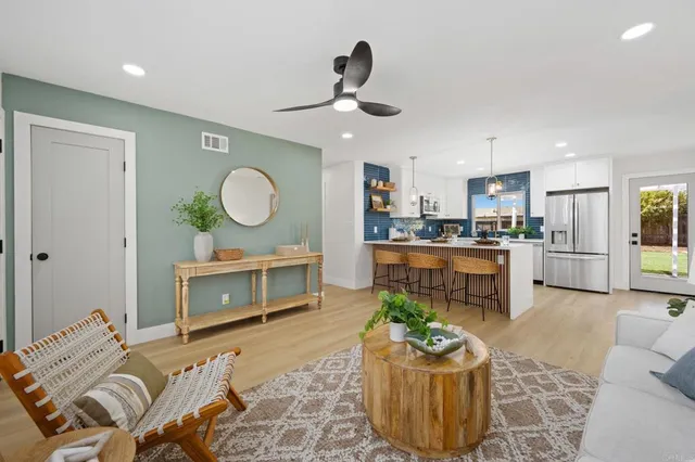 a living room with furniture and a fireplace