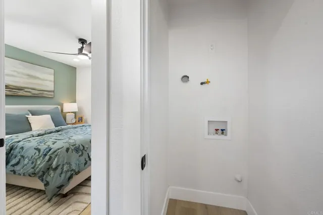 a bedroom with a bed and a view of bedroom