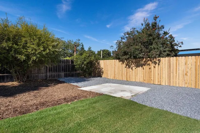 a view of backyard with green space
