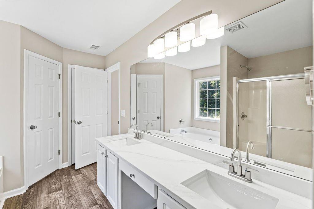 473 Greyhawk Way Fairburn, GA 30213 - Photo 25 of 34 a bathroom with a sink double vanity and a mirror