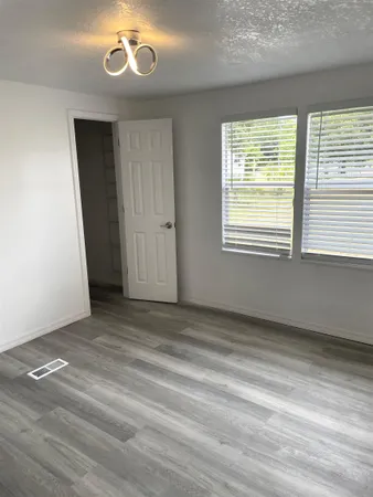 a view of an empty room with a window