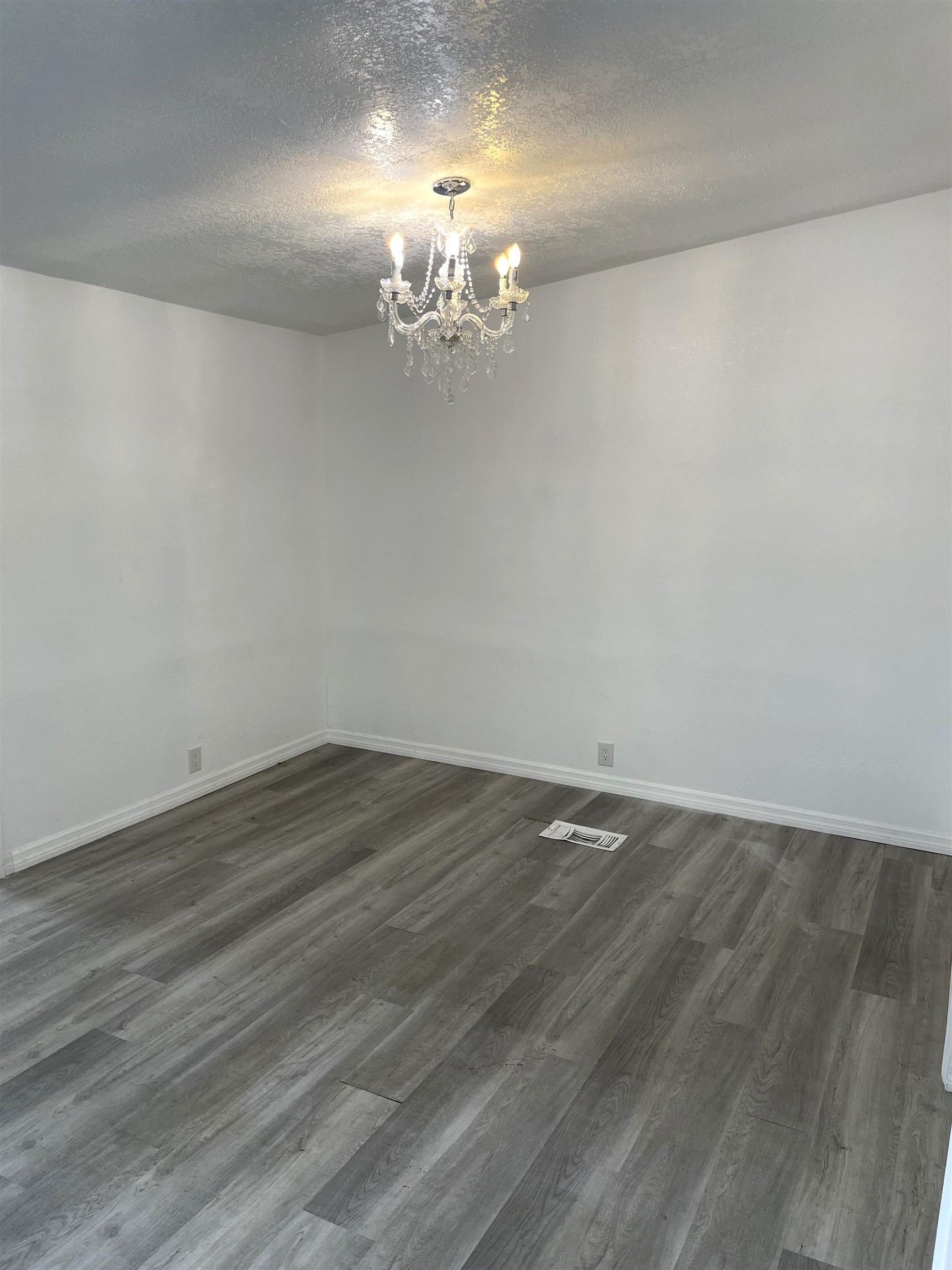 3125 Audra Road St. Augustine, FL 32084 - Photo 5 of 15 a view of a room with wooden floor and chandelier