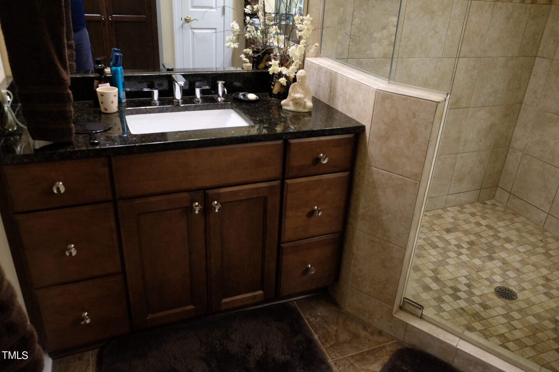 9545 Brookchase Drive Raleigh, NC 27617 - Photo 19 of 46 a bathroom with a sink and a mirror