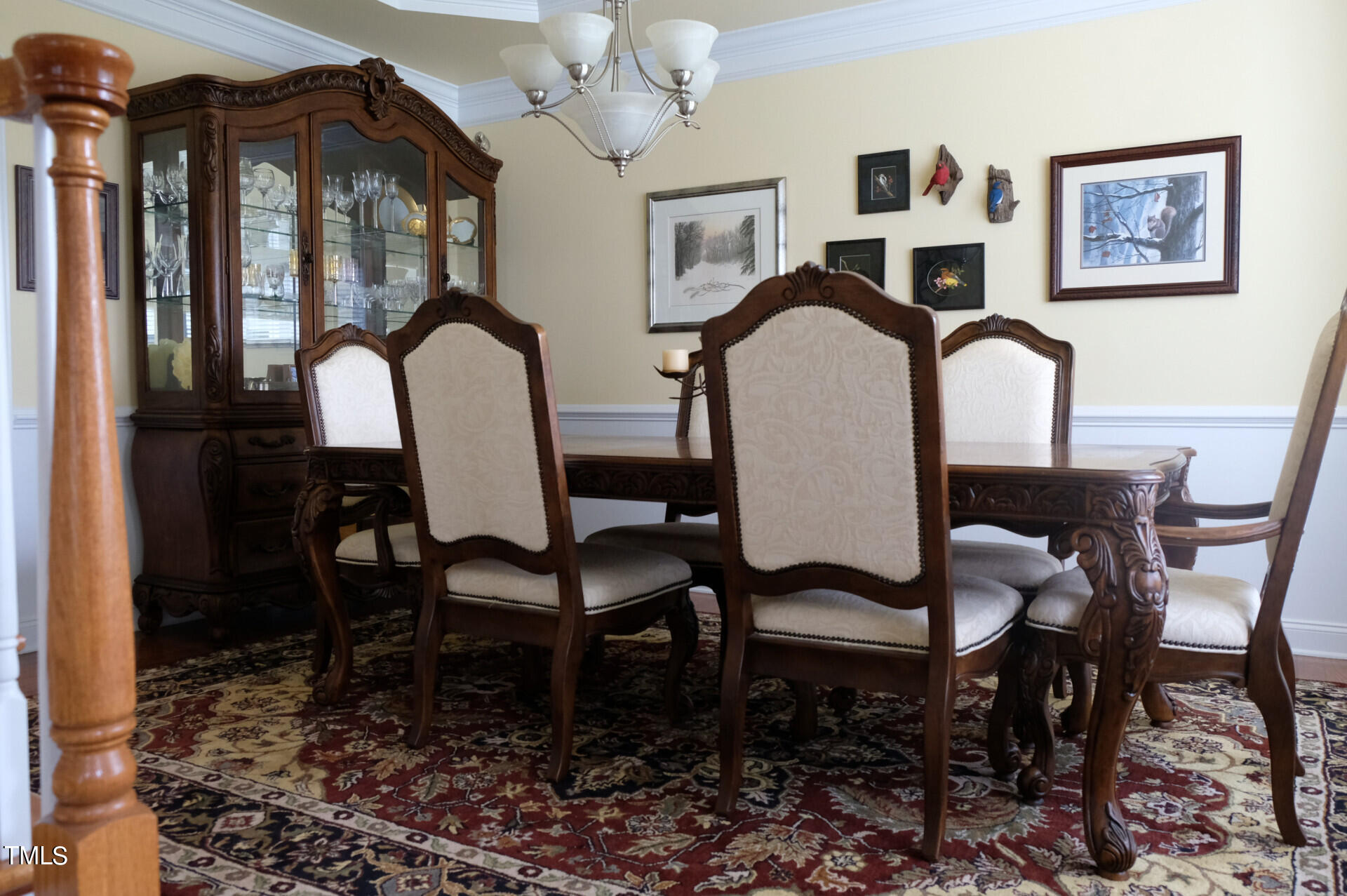9545 Brookchase Drive Raleigh, NC 27617 - Photo 23 of 46 a view of a dining room with furniture and chandelier
