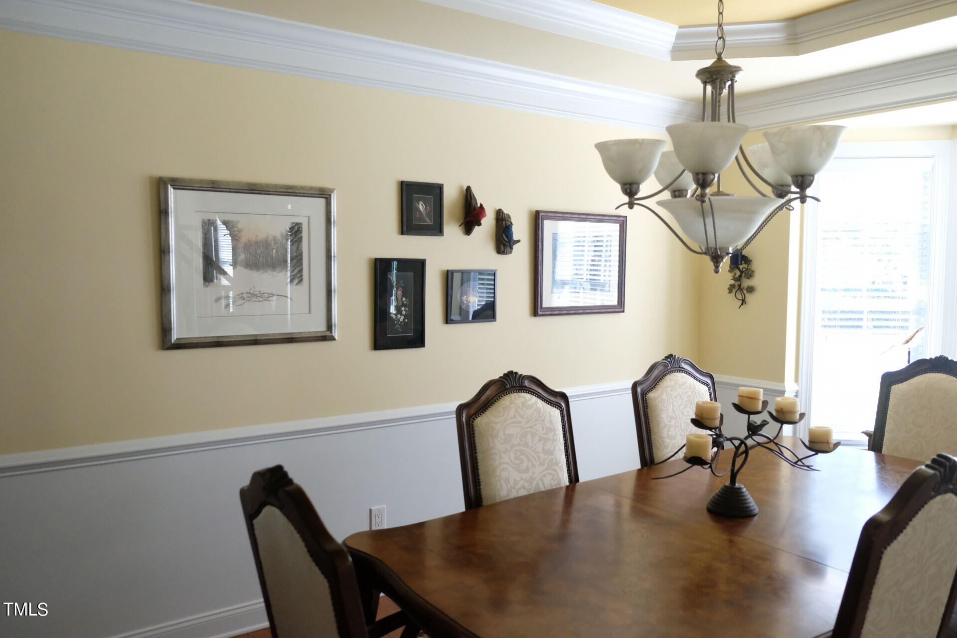 9545 Brookchase Drive Raleigh, NC 27617 - Photo 26 of 46 a view of a dining room with furniture and chandelier