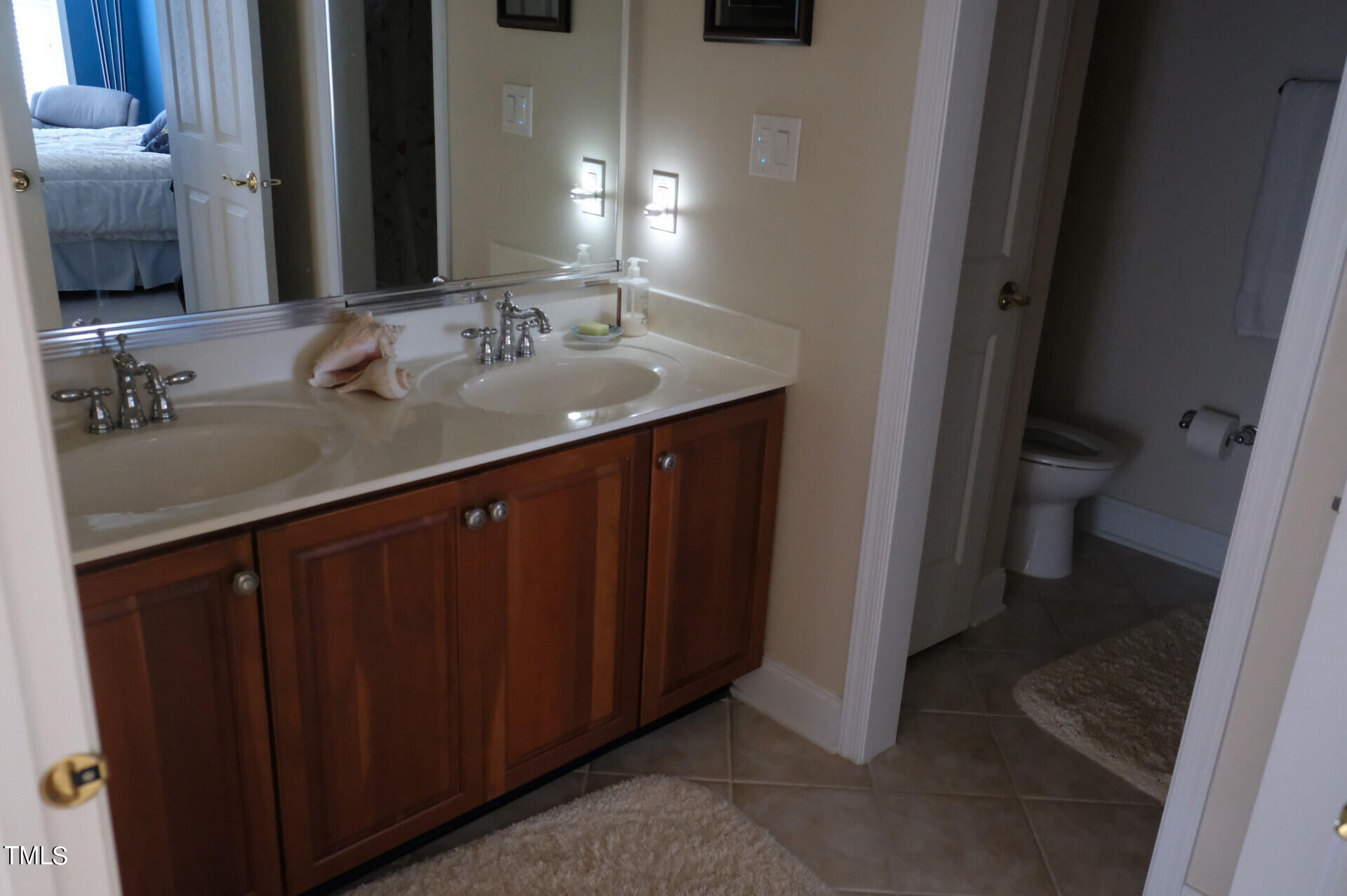 9545 Brookchase Drive Raleigh, NC 27617 - Photo 30 of 46 a bathroom with a sink and a mirror