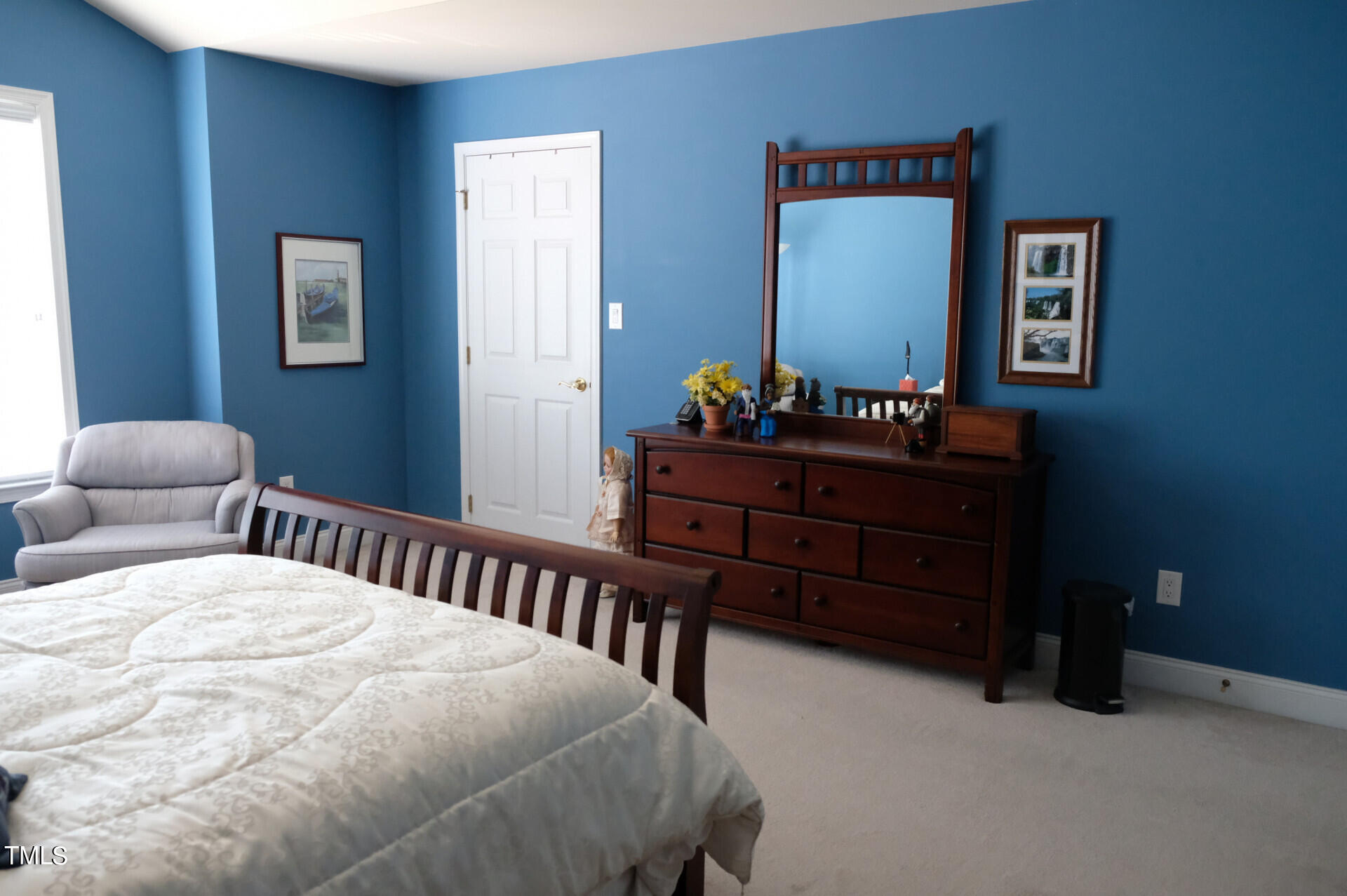 9545 Brookchase Drive Raleigh, NC 27617 - Photo 32 of 46 a bedroom with a bed and a lamp on dresser