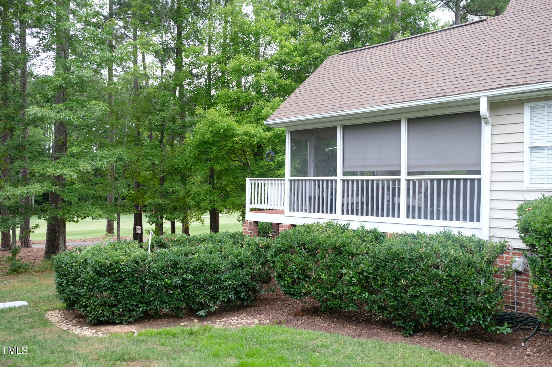 9545 Brookchase Drive Raleigh, NC 27617 - Photo 38 of 46 a house with lots of trees in the background