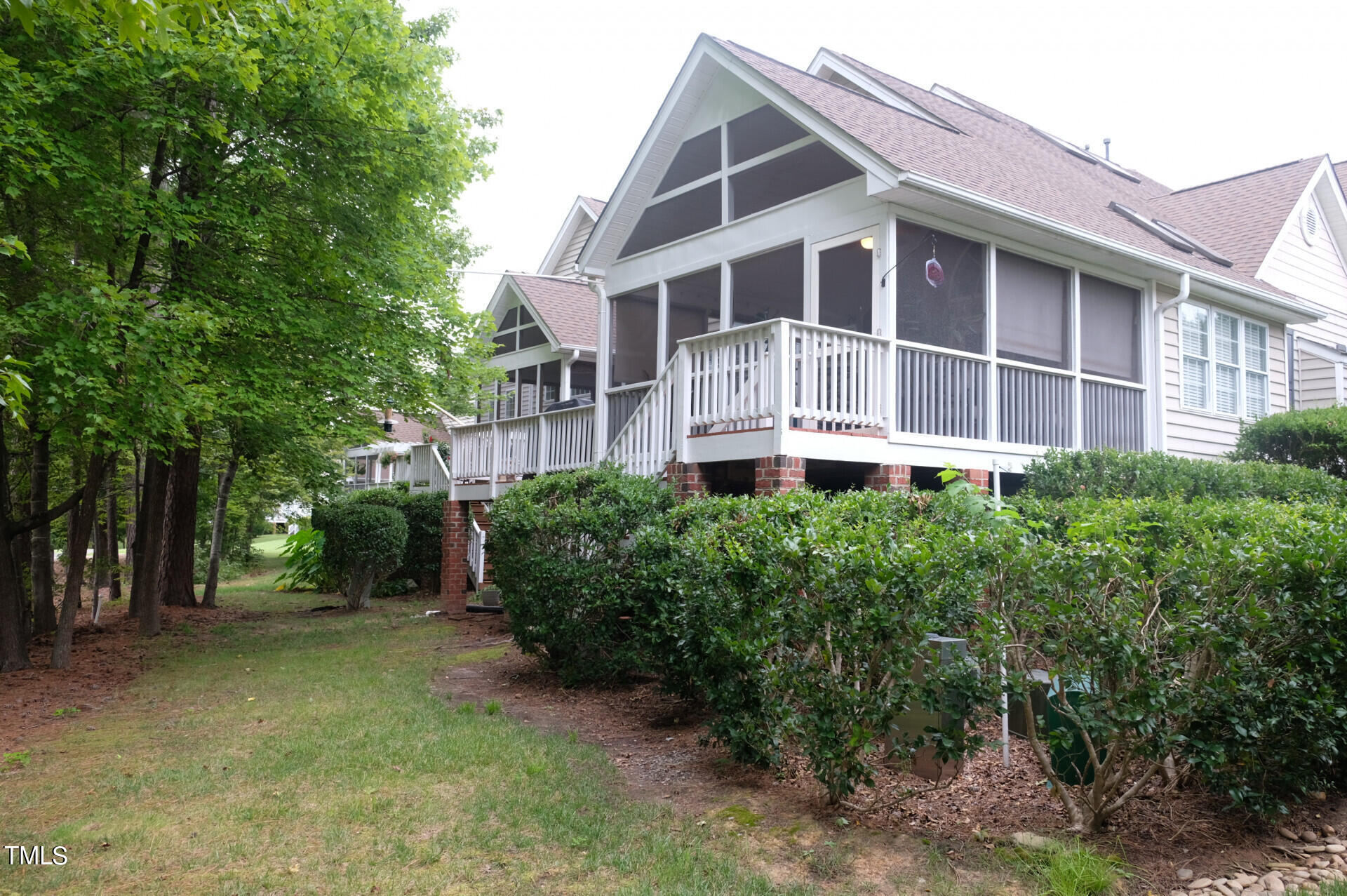 9545 Brookchase Drive Raleigh, NC 27617 - Photo 39 of 46 a front view of a house with plants and trees