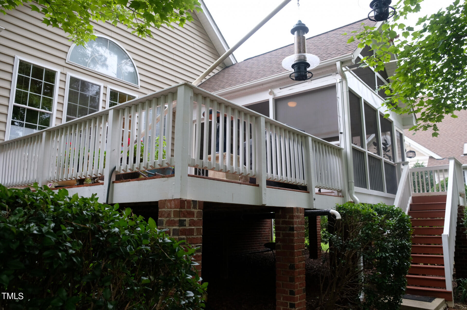 9545 Brookchase Drive Raleigh, NC 27617 - Photo 40 of 46 a view of a house with brick walls and flower plants