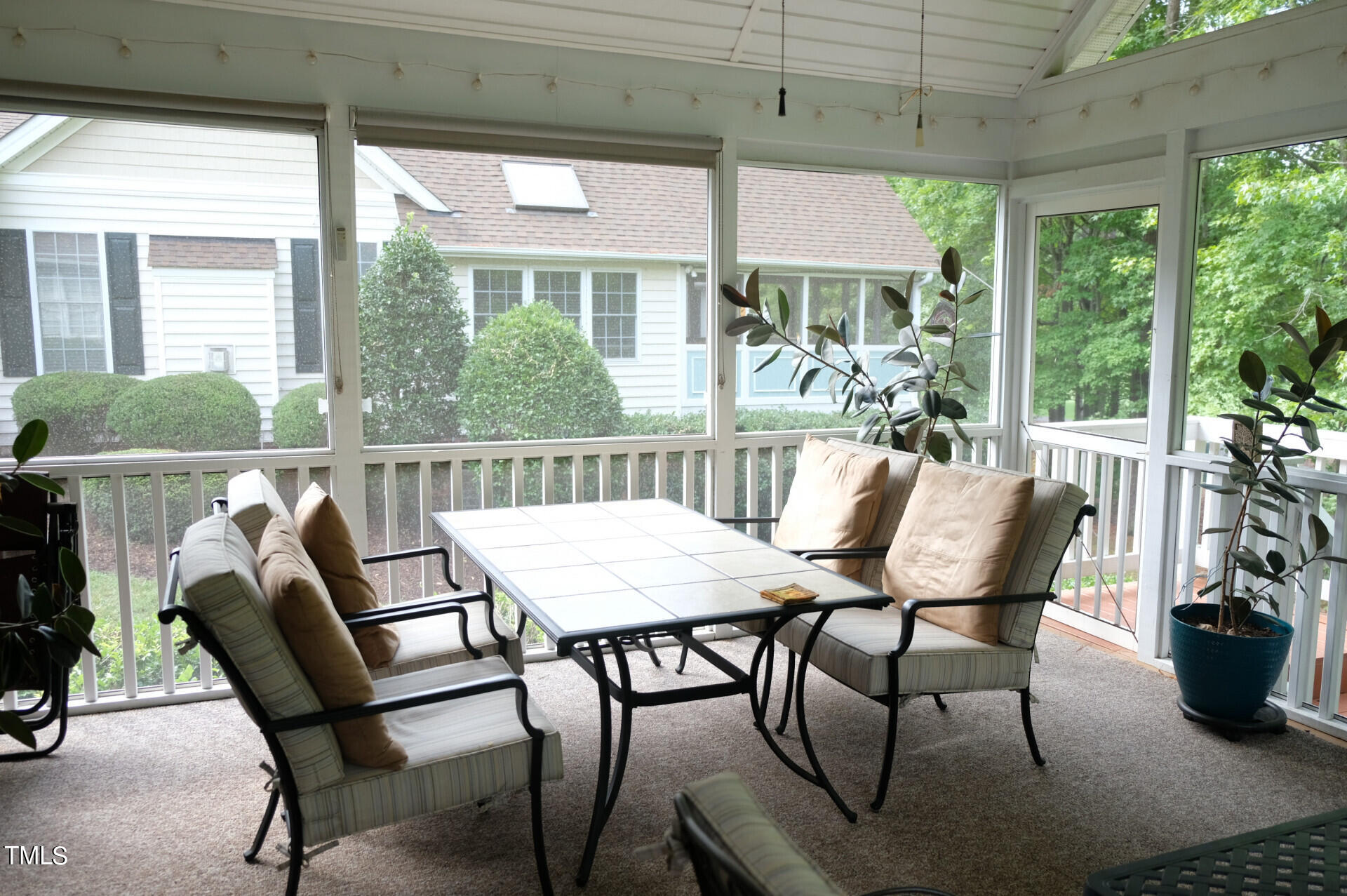 9545 Brookchase Drive Raleigh, NC 27617 - Photo 43 of 46 a view of a patio with table and chairs