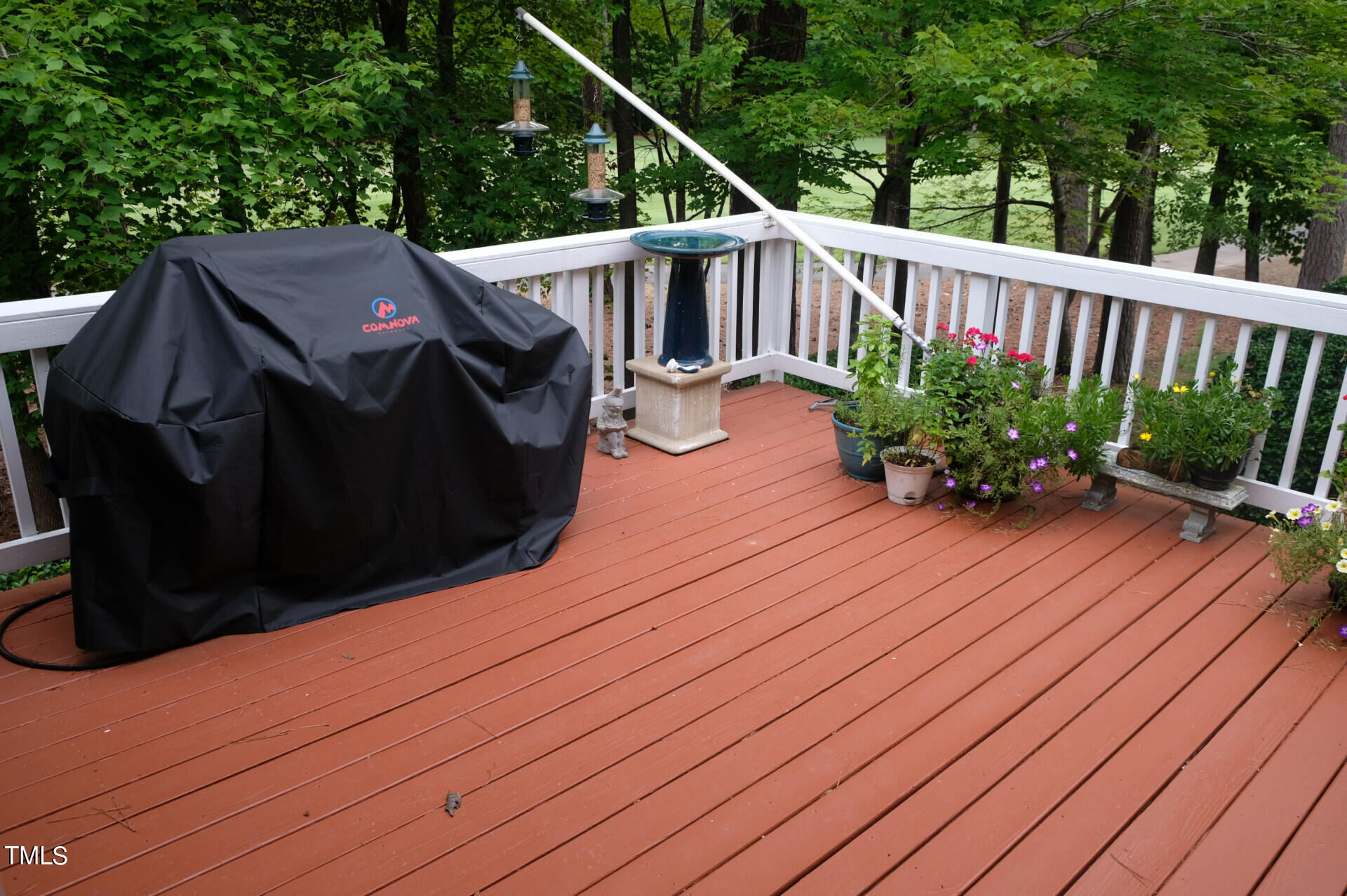 9545 Brookchase Drive Raleigh, NC 27617 - Photo 44 of 46 a balcony with wooden floor in front of it