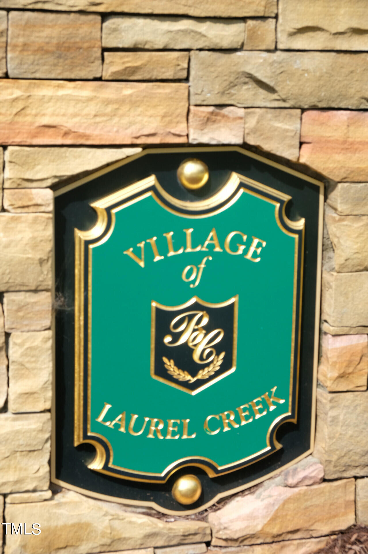 9545 Brookchase Drive Raleigh, NC 27617 - Photo 45 of 46 a sign that is on the side of a building