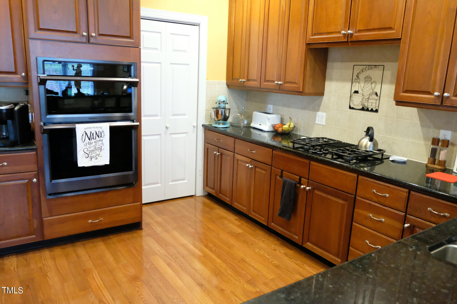 9545 Brookchase Drive Raleigh, NC 27617 - Photo 10 of 46 a kitchen with stainless steel appliances granite countertop a refrigerator and a stove