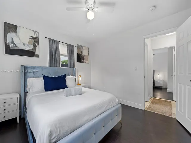 a bedroom with a bed and a view of bedroom