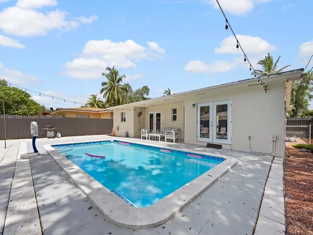 a view of a house with swimming pool