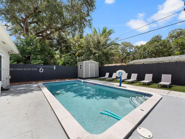 a wooden bench sitting in front of a house