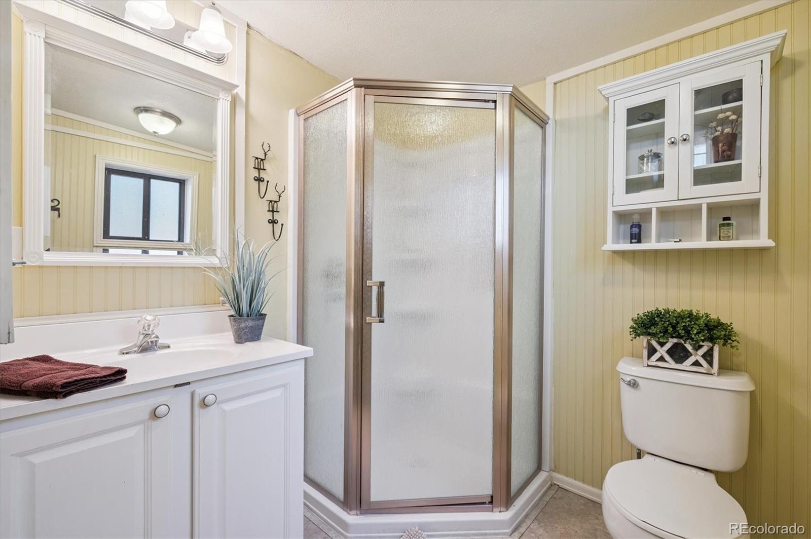 990 Rd P69 Bailey, CO 80421 - Photo 13 of 17 a bathroom with a sink toilet and shower