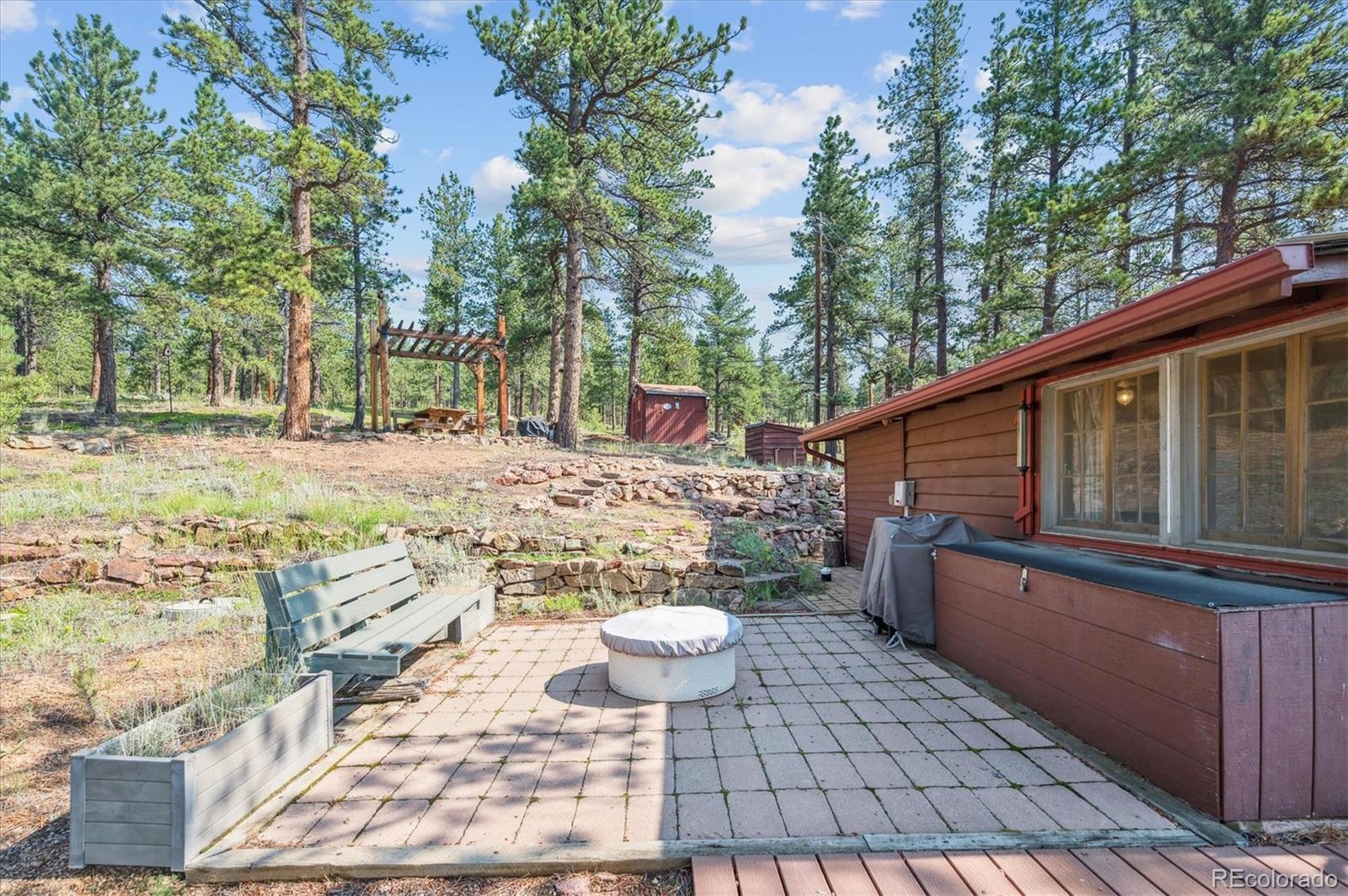 990 Rd P69 Bailey, CO 80421 - Photo 14 of 17 a view of a backyard with sitting area