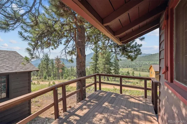 a view of a patio with wooden floor