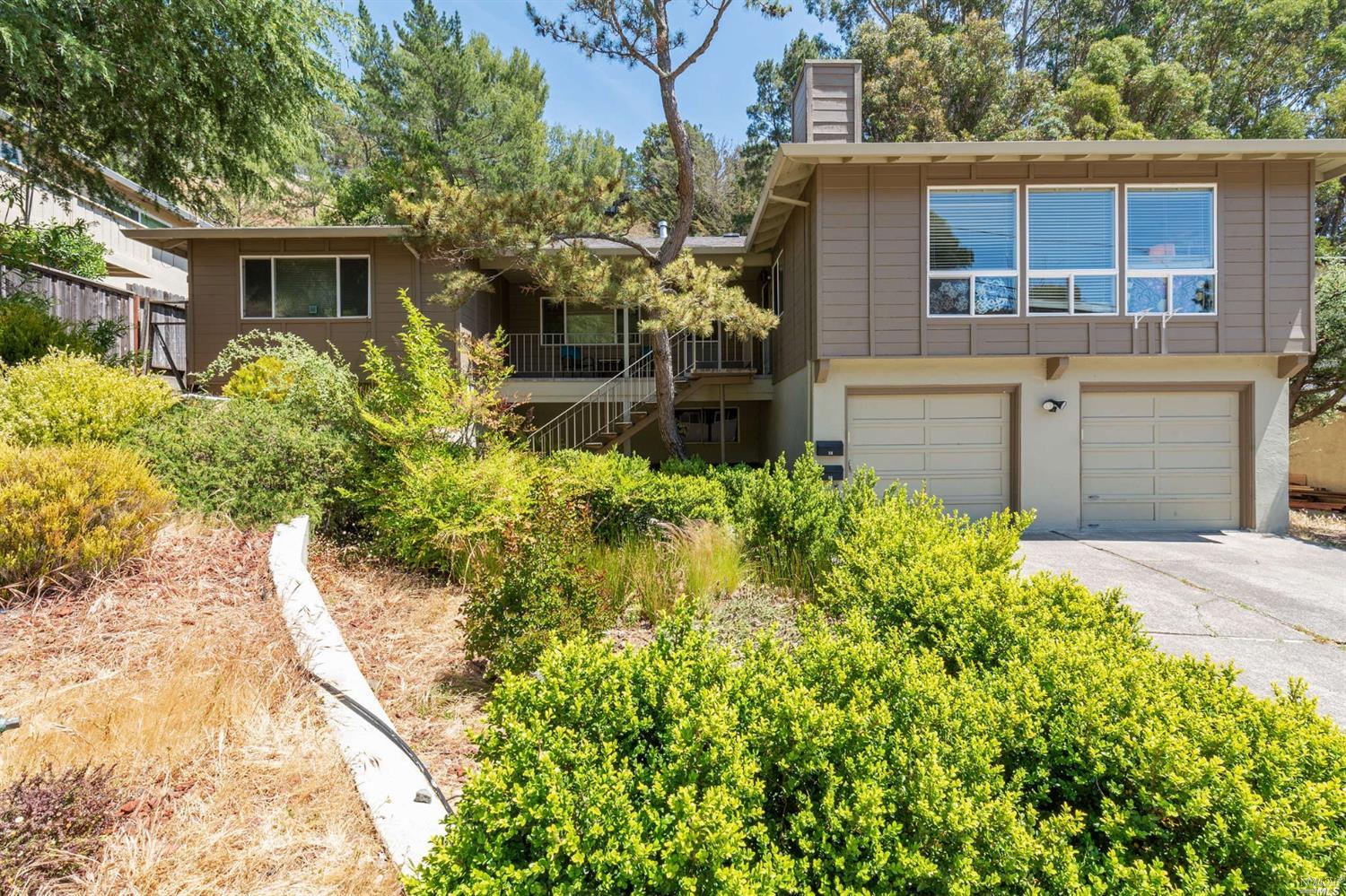 56-58 Elizabeth Way San Rafael, CA 94901 - Photo 1 of 1 a front view of a house with a yard and garage