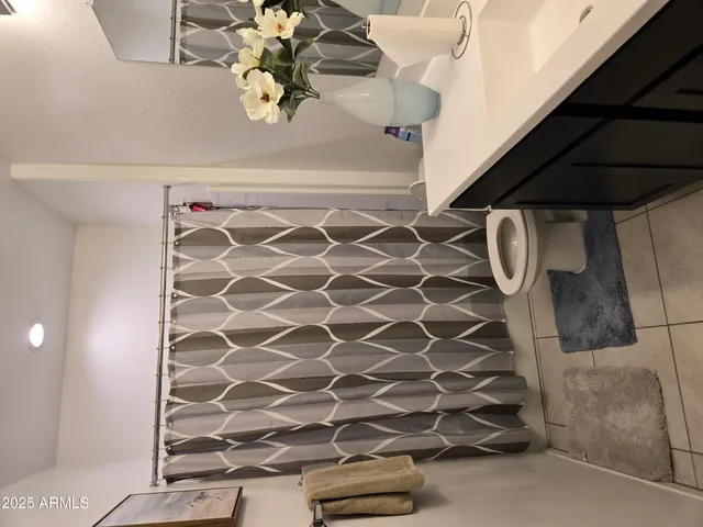 a bathroom with a sink double vanity and a mirror