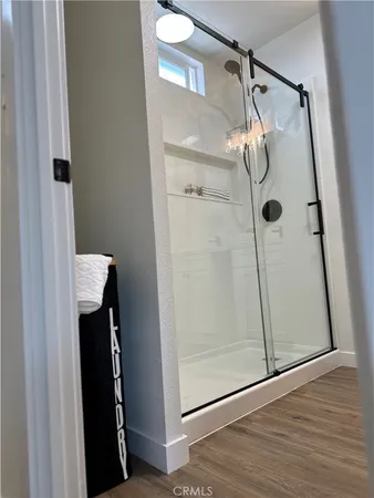 a bathroom with a glass shower door