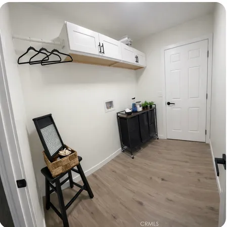 a view of workspace with wooden floor