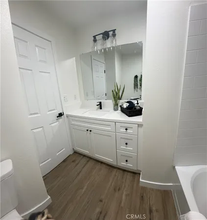 a view of cabinets and wooden floor