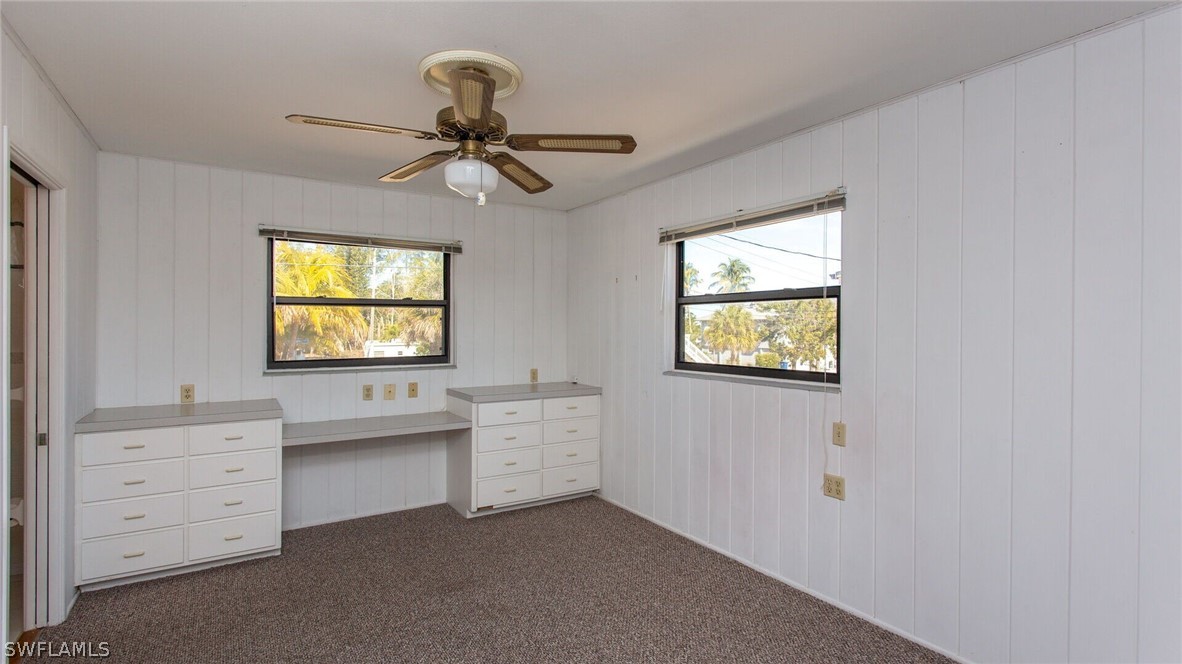 360 Bayland Road Fort Myers Beach, FL 33931 - Photo 16 of 35 a room with cabinets and window