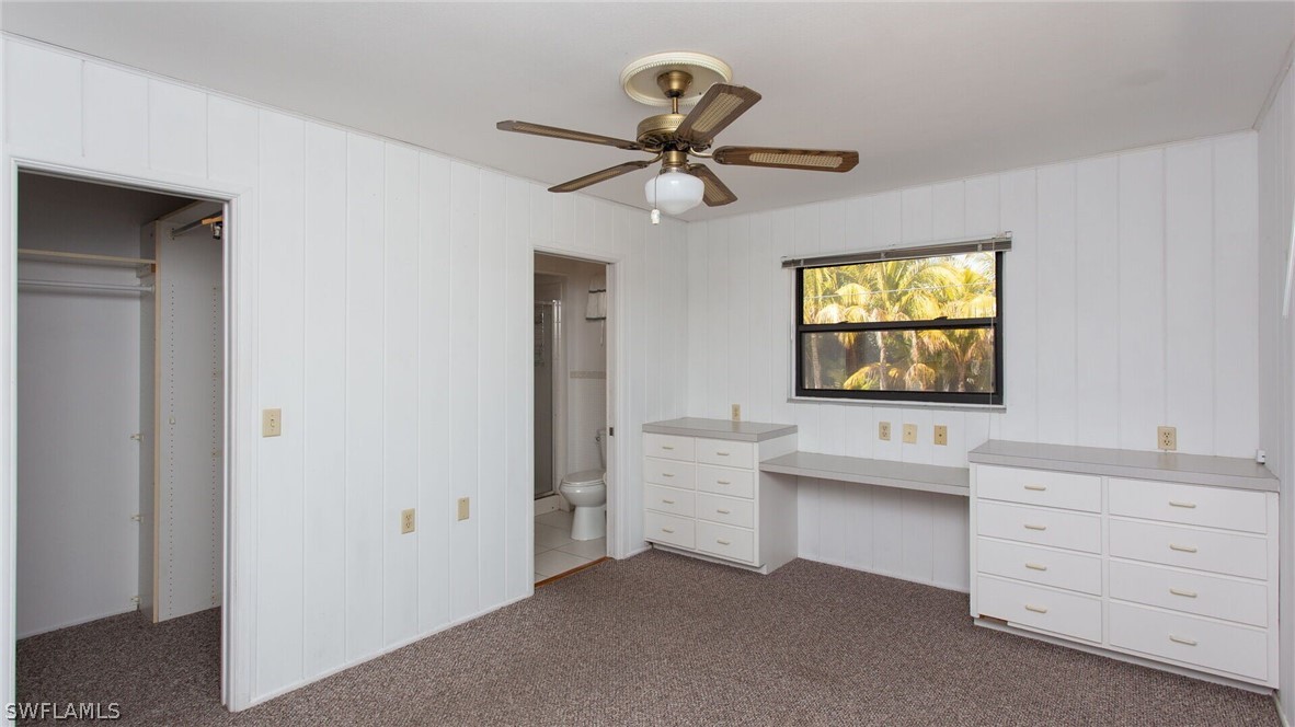 360 Bayland Road Fort Myers Beach, FL 33931 - Photo 17 of 35 a room with two windows and a ceiling fan