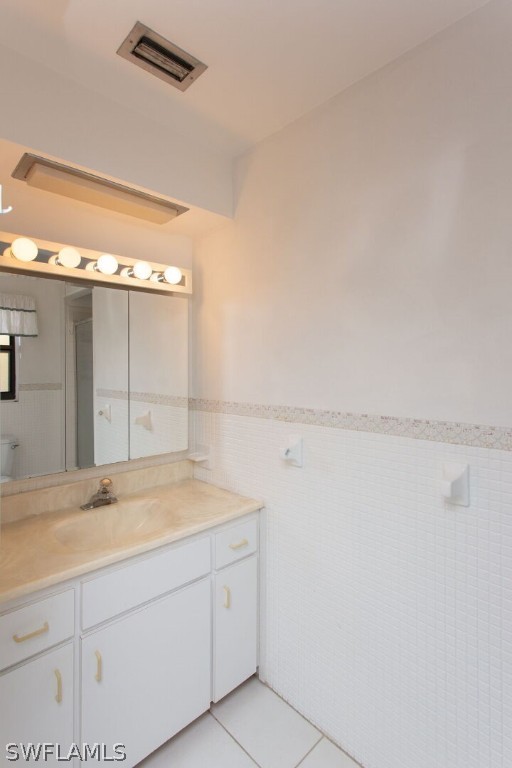 360 Bayland Road Fort Myers Beach, FL 33931 - Photo 18 of 35 a bathroom with a sink and a vanity