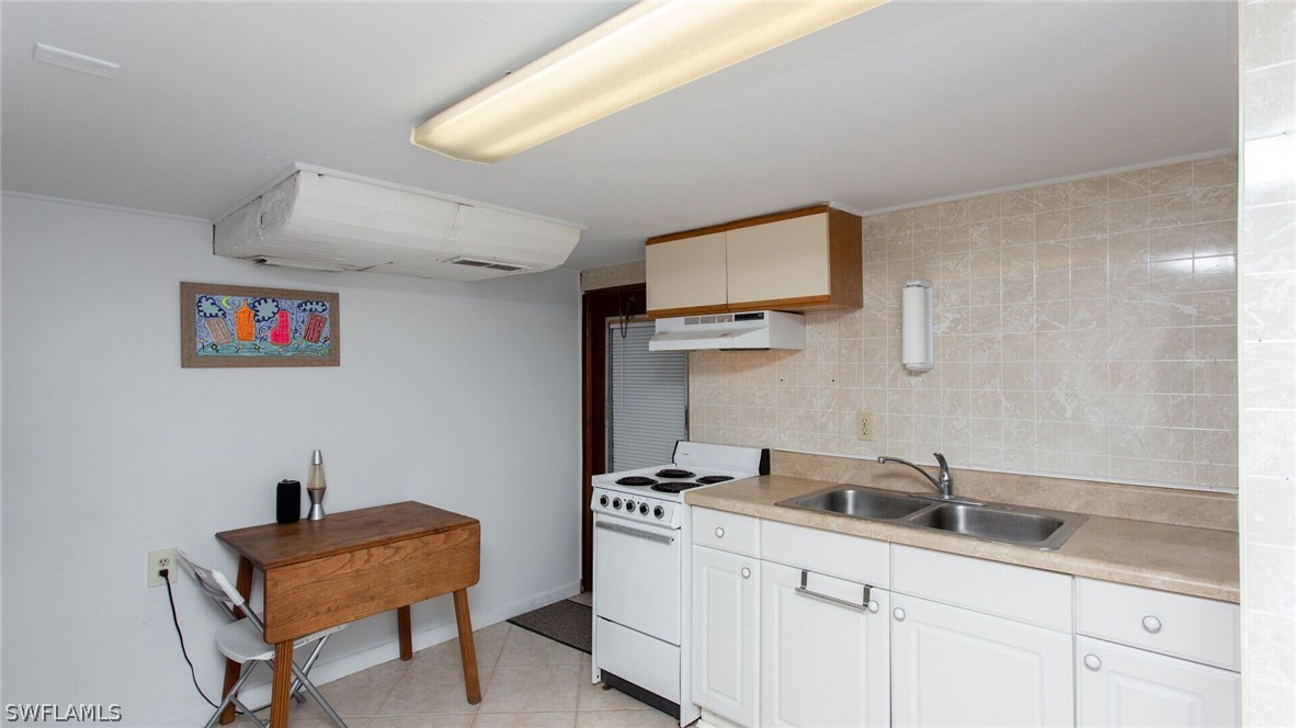 360 Bayland Road Fort Myers Beach, FL 33931 - Photo 22 of 35 a room with storage and utility