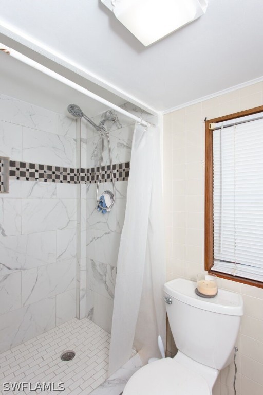 360 Bayland Road Fort Myers Beach, FL 33931 - Photo 23 of 35 a bathroom with a shower a toilet and a sink